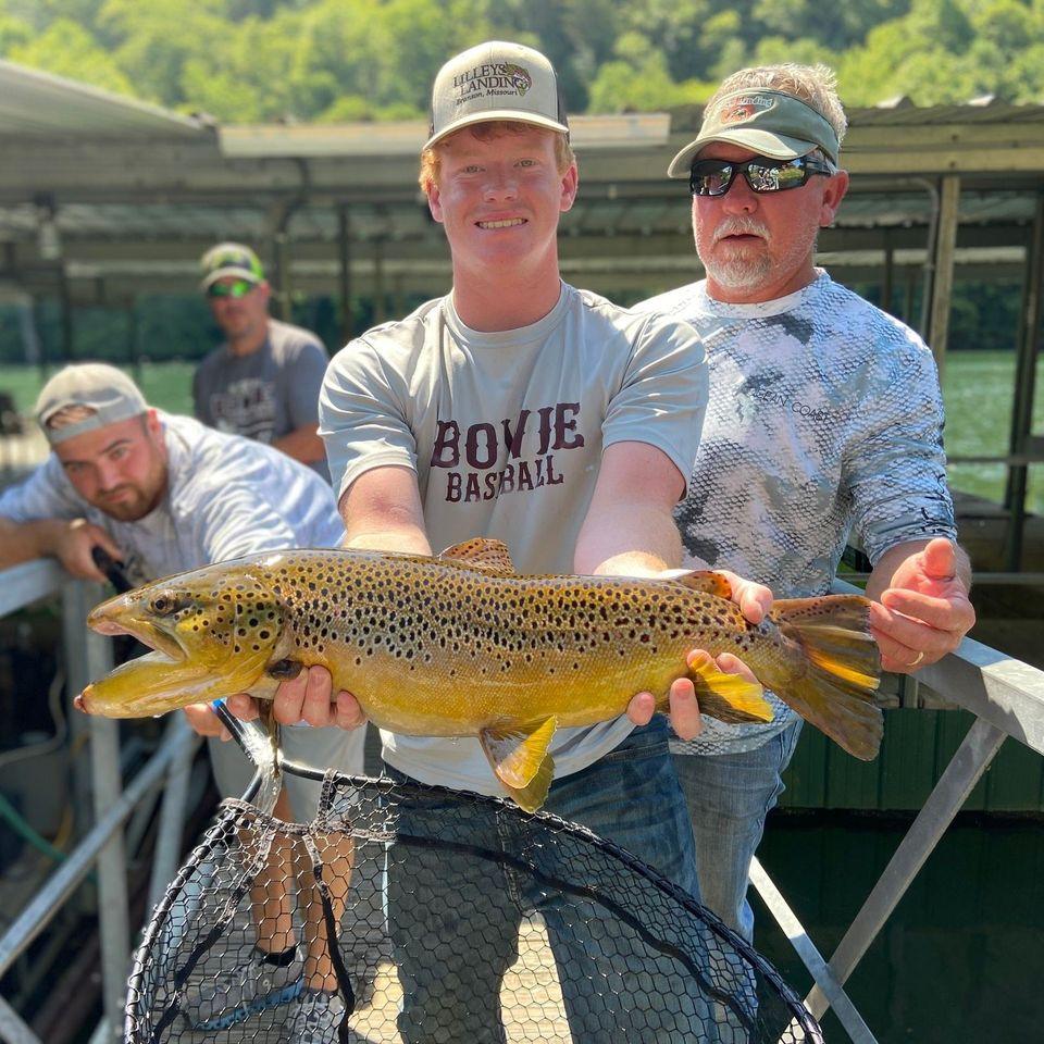 Four people enjoying a fishing trip in Missouri