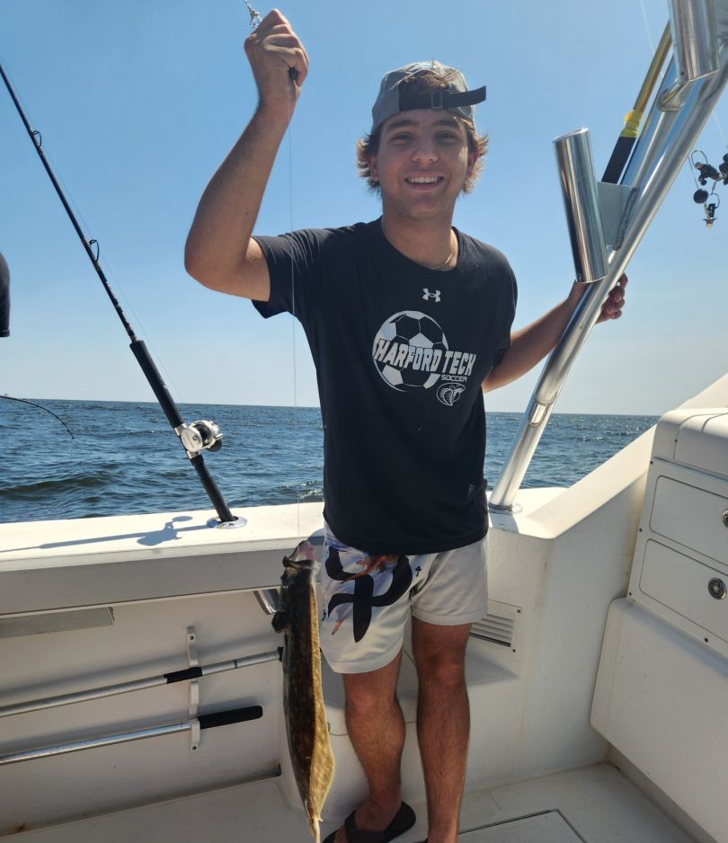 Successful fishing trip on boat in Neptune City NJ with caught fish