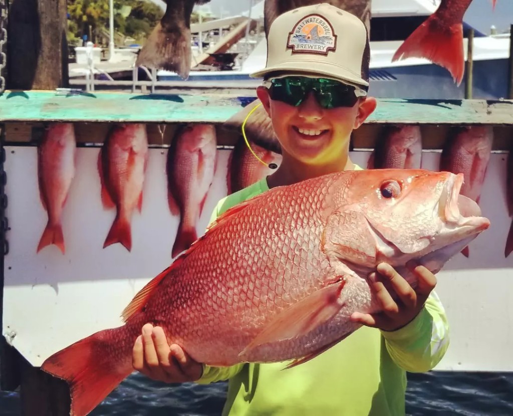 Angler holding a fish in Destin