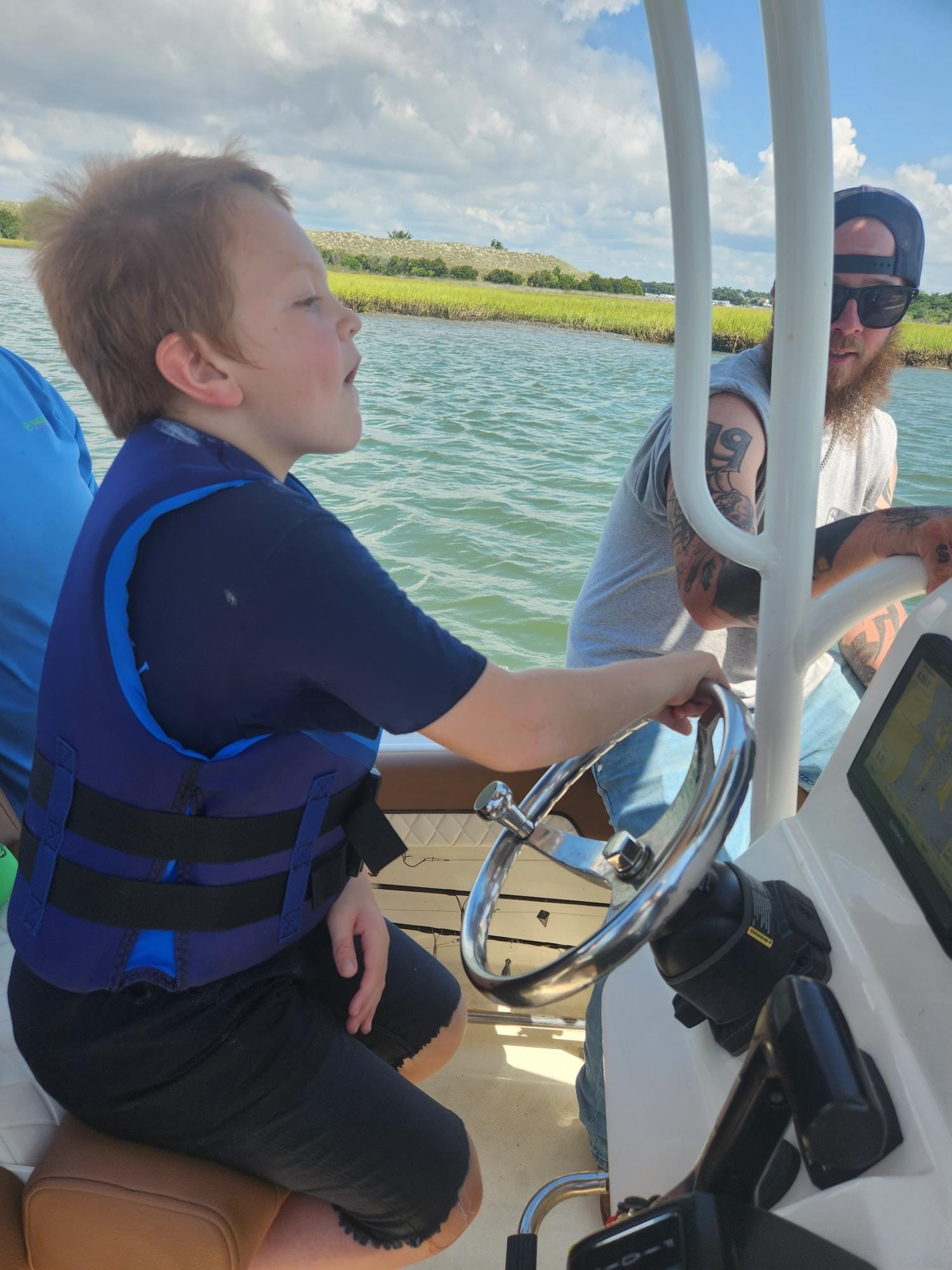 Three people enjoying a fishing trip in Stella