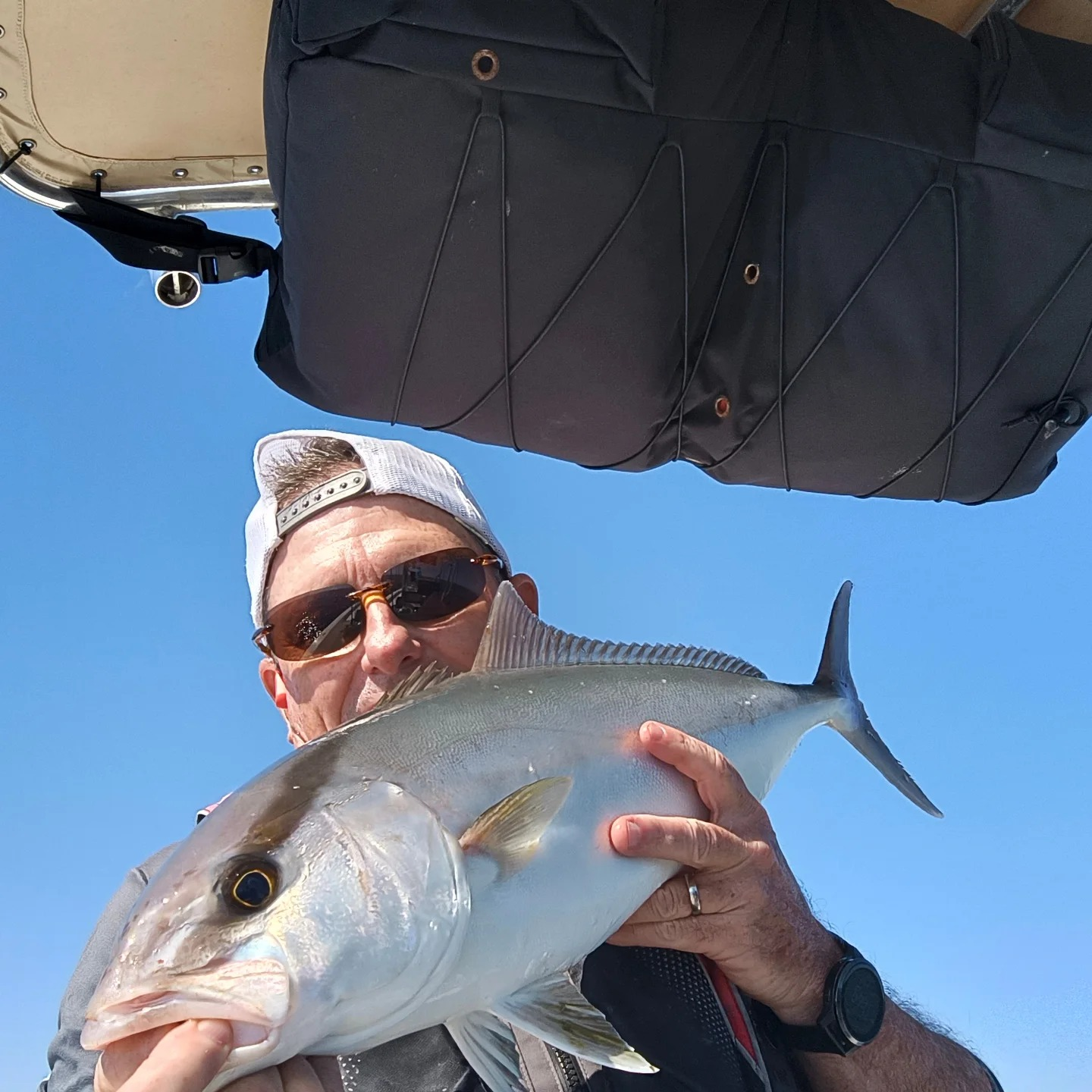 A lone fisherman reeling in a catch in FL