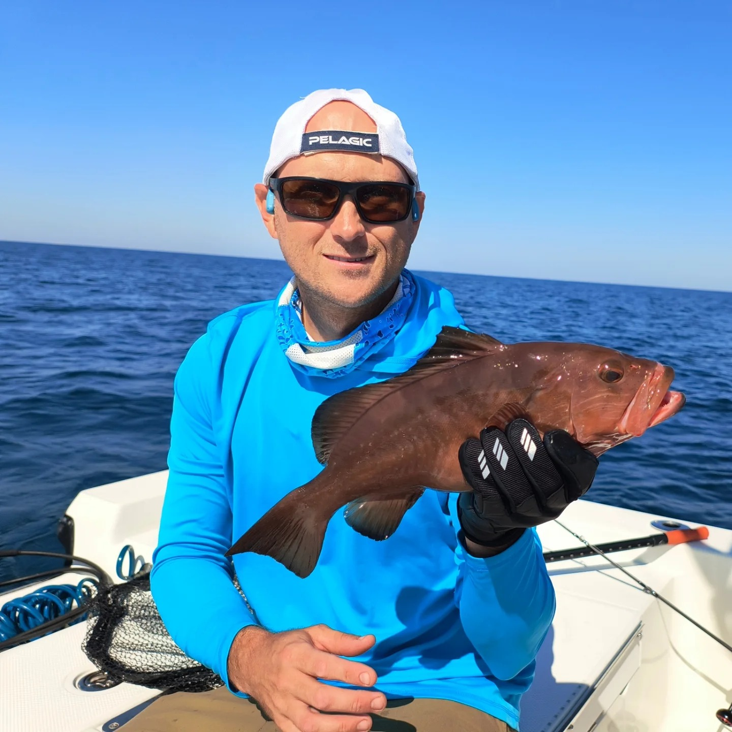 Angler catching a fish in Gulf Breeze