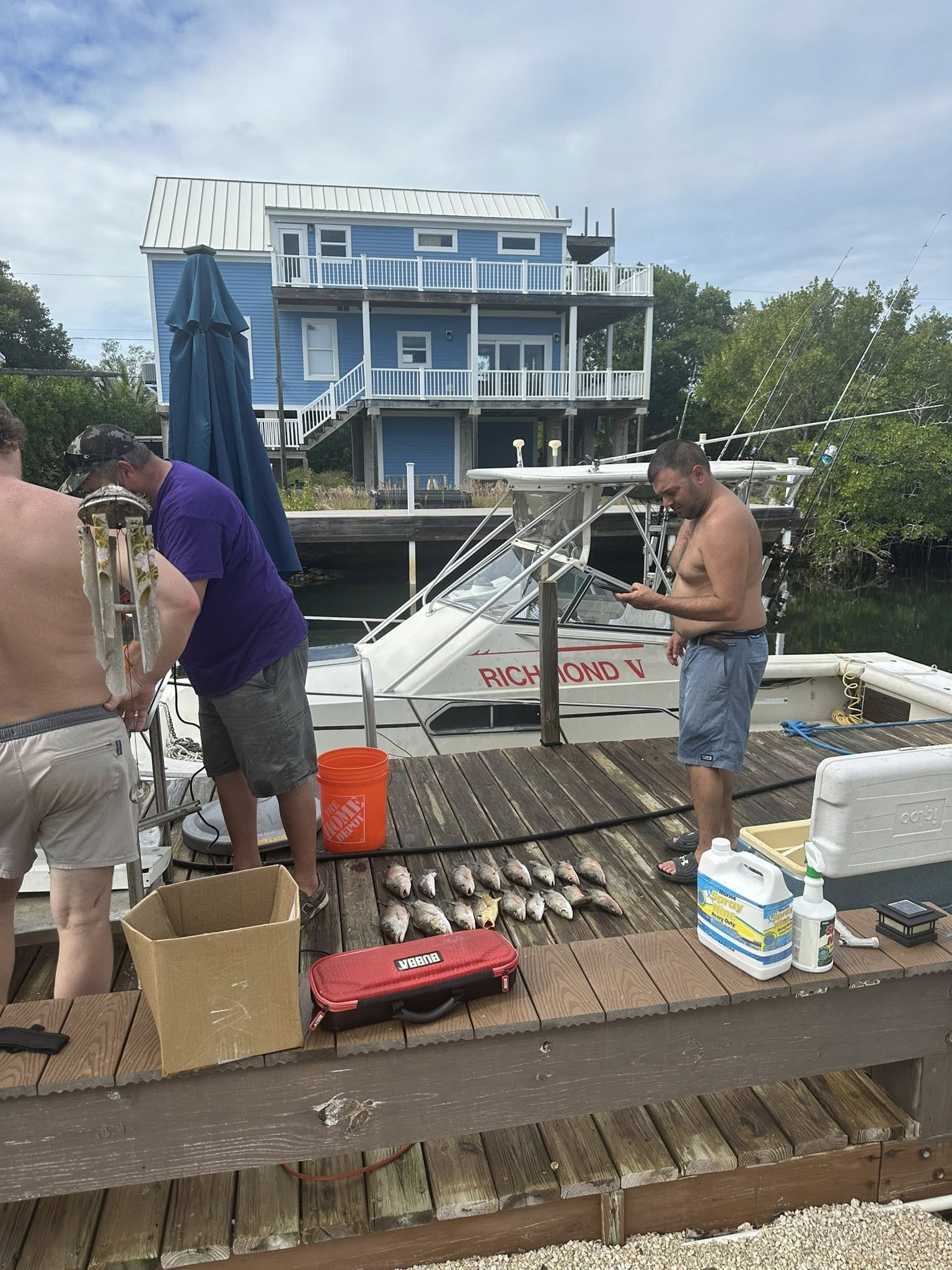 Fresh caught fish laid out on wooden dock after fishing trip in South Bristol NY