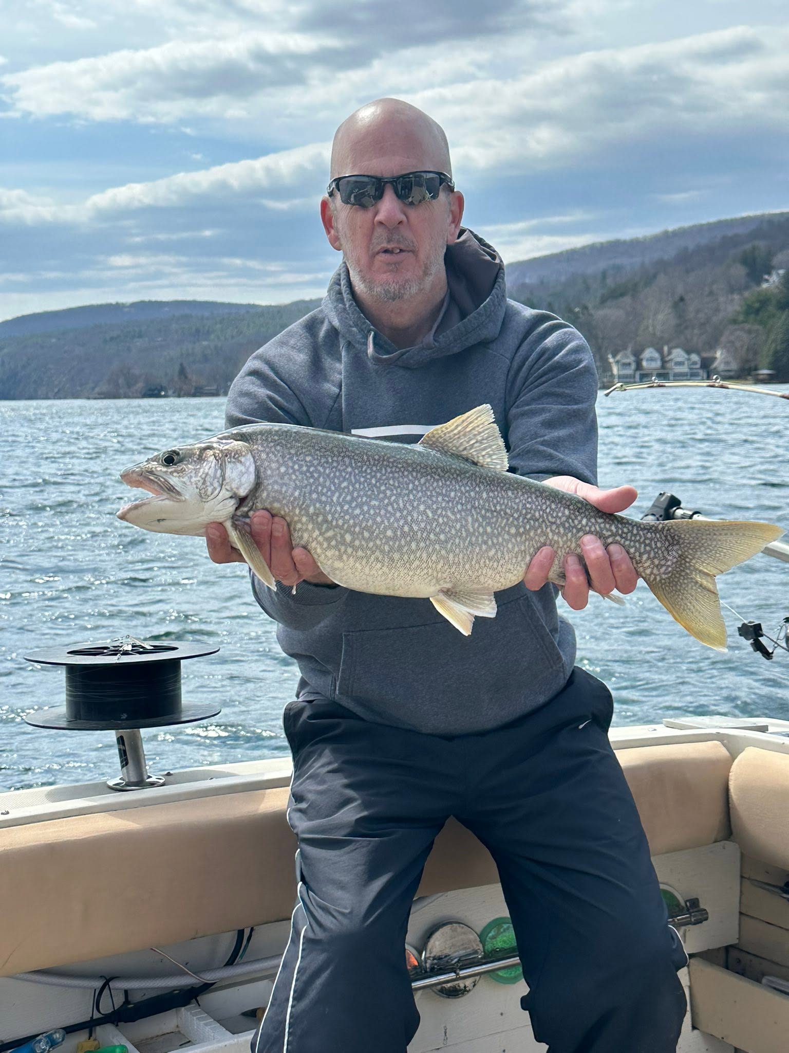 Lake trout caught fishing in South Bristol NY held on boat deck
