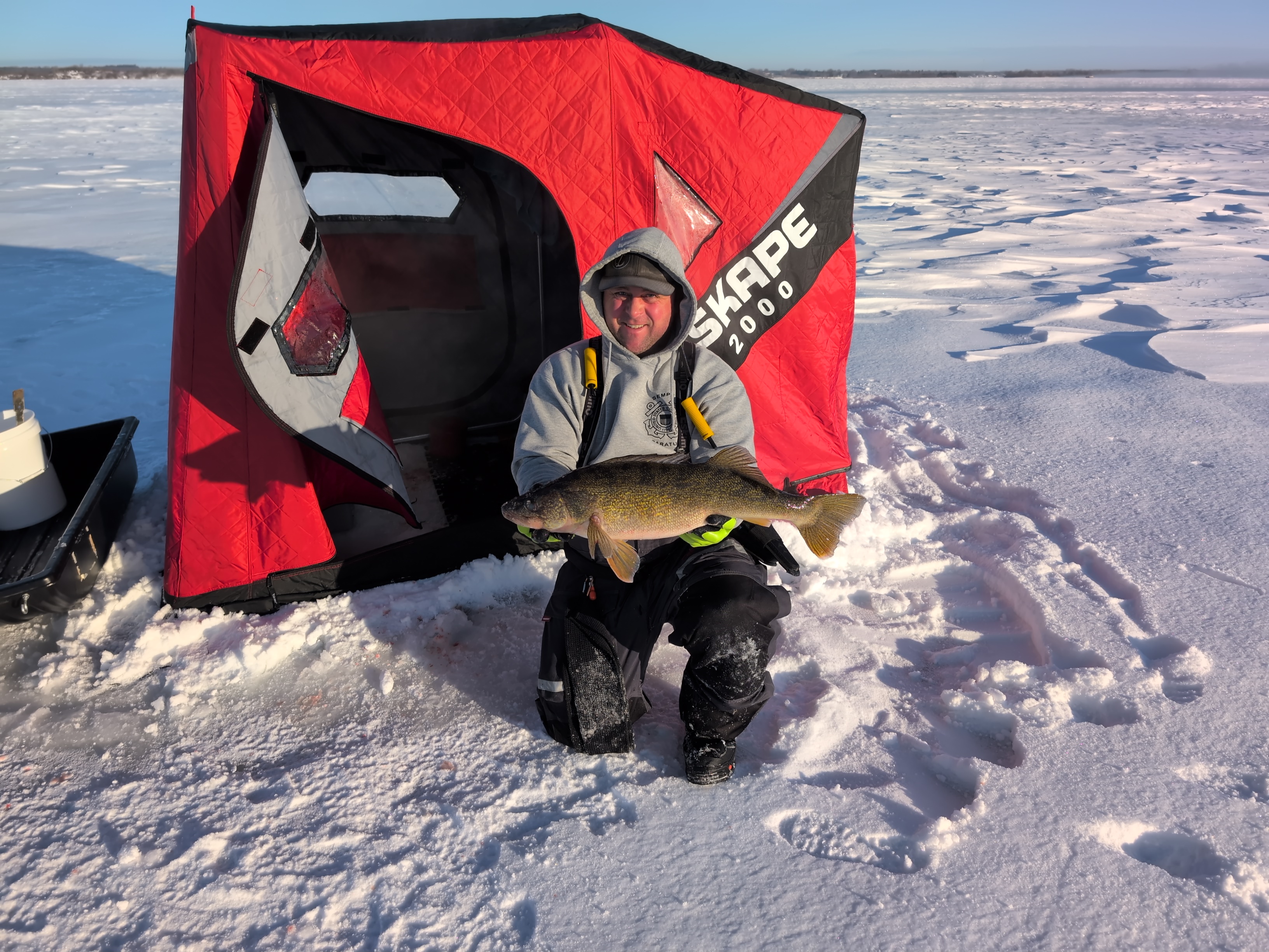 Angler with a big 22-inch walleye caught while fishing in NY