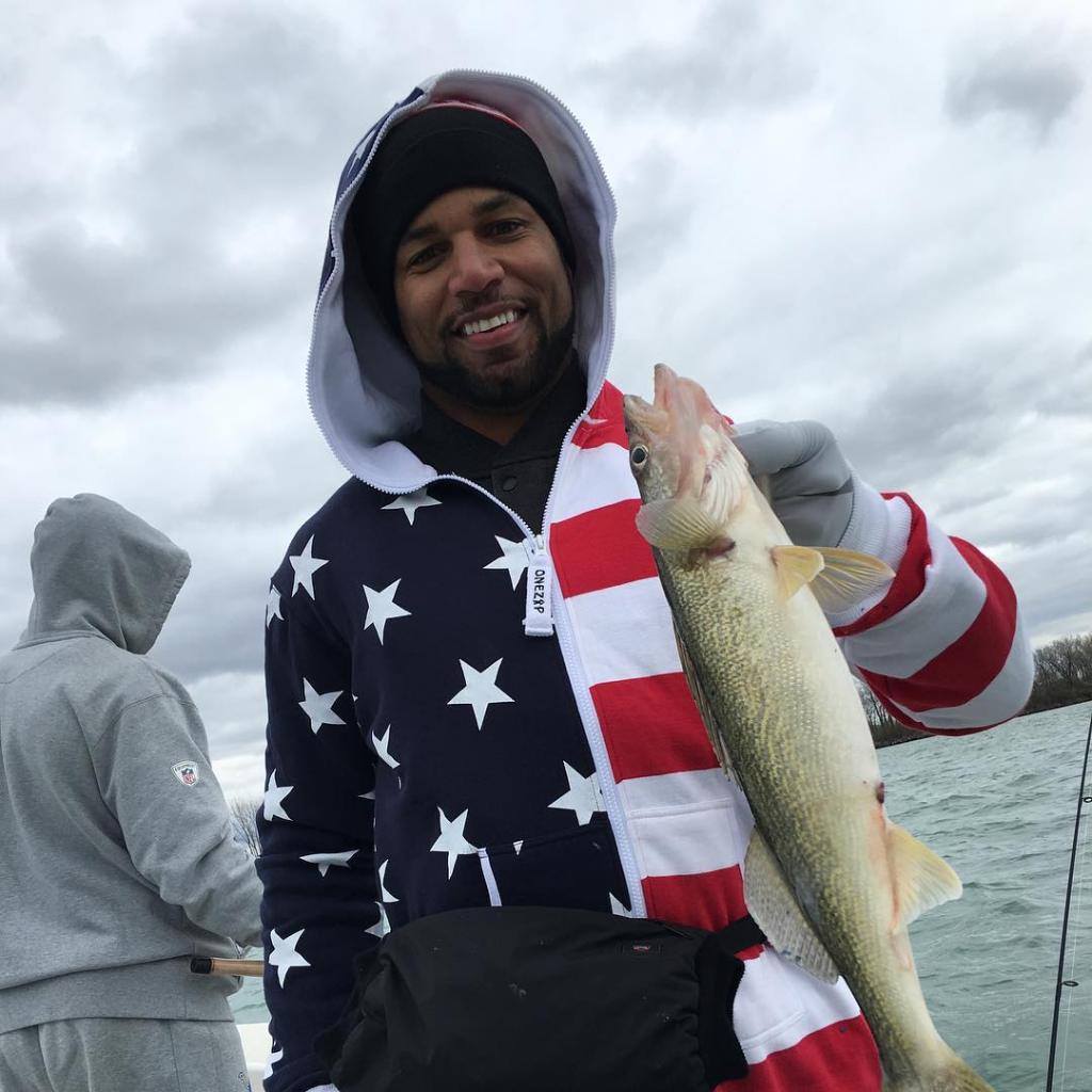 Angler holding a 17-inch fish in MI