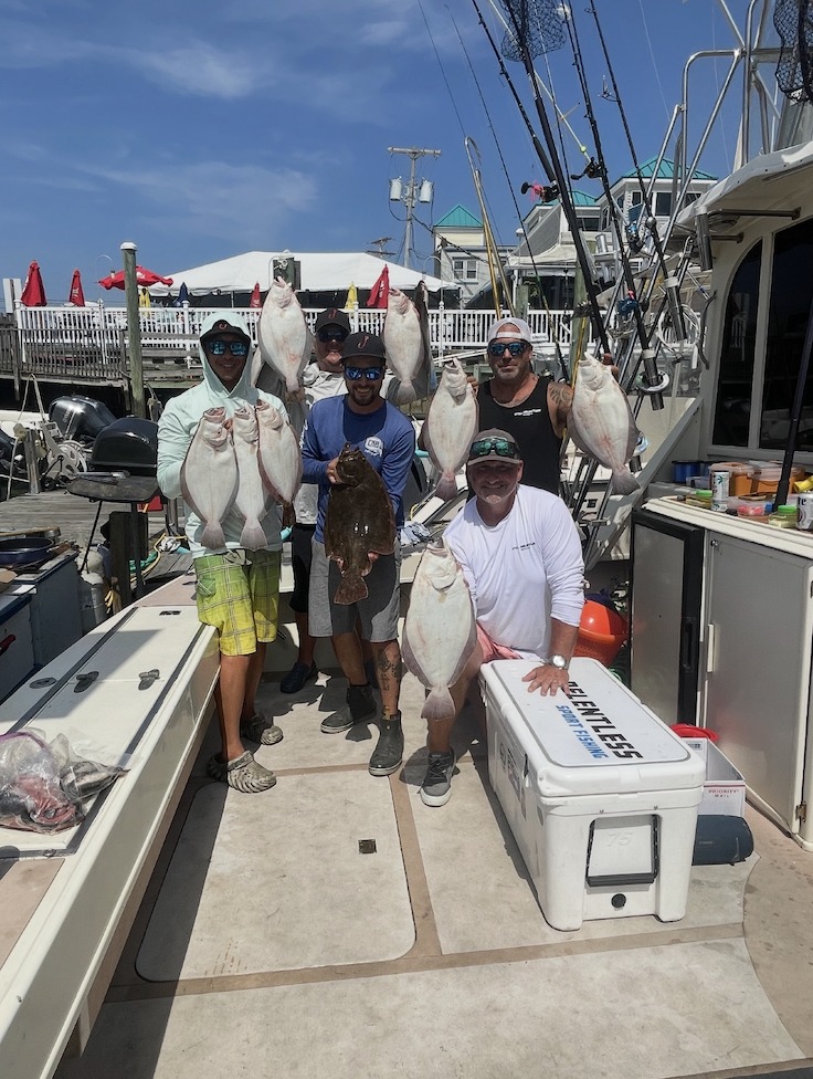 Successful fishing charter displaying summer flounder and other fish species caught in Belmar NJ waters