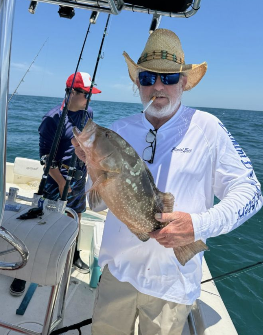 Fisherman with a catch in Clearwater