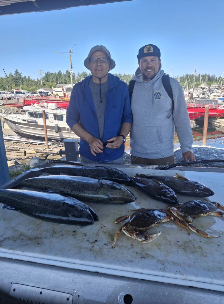 Fresh caught fish and crabs displayed on fishing boat deck in Nanaimo BC marina