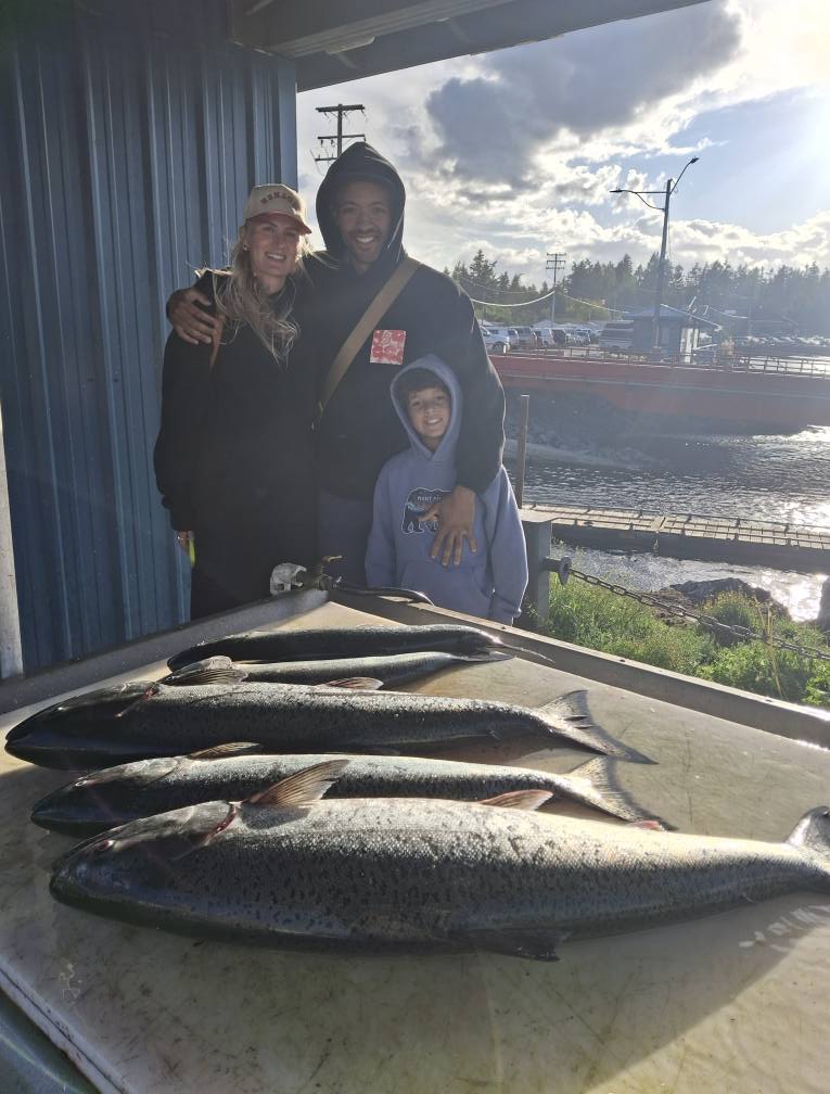Fresh caught salmon and other fish displayed on cleaning table at Nanaimo BC fishing dock