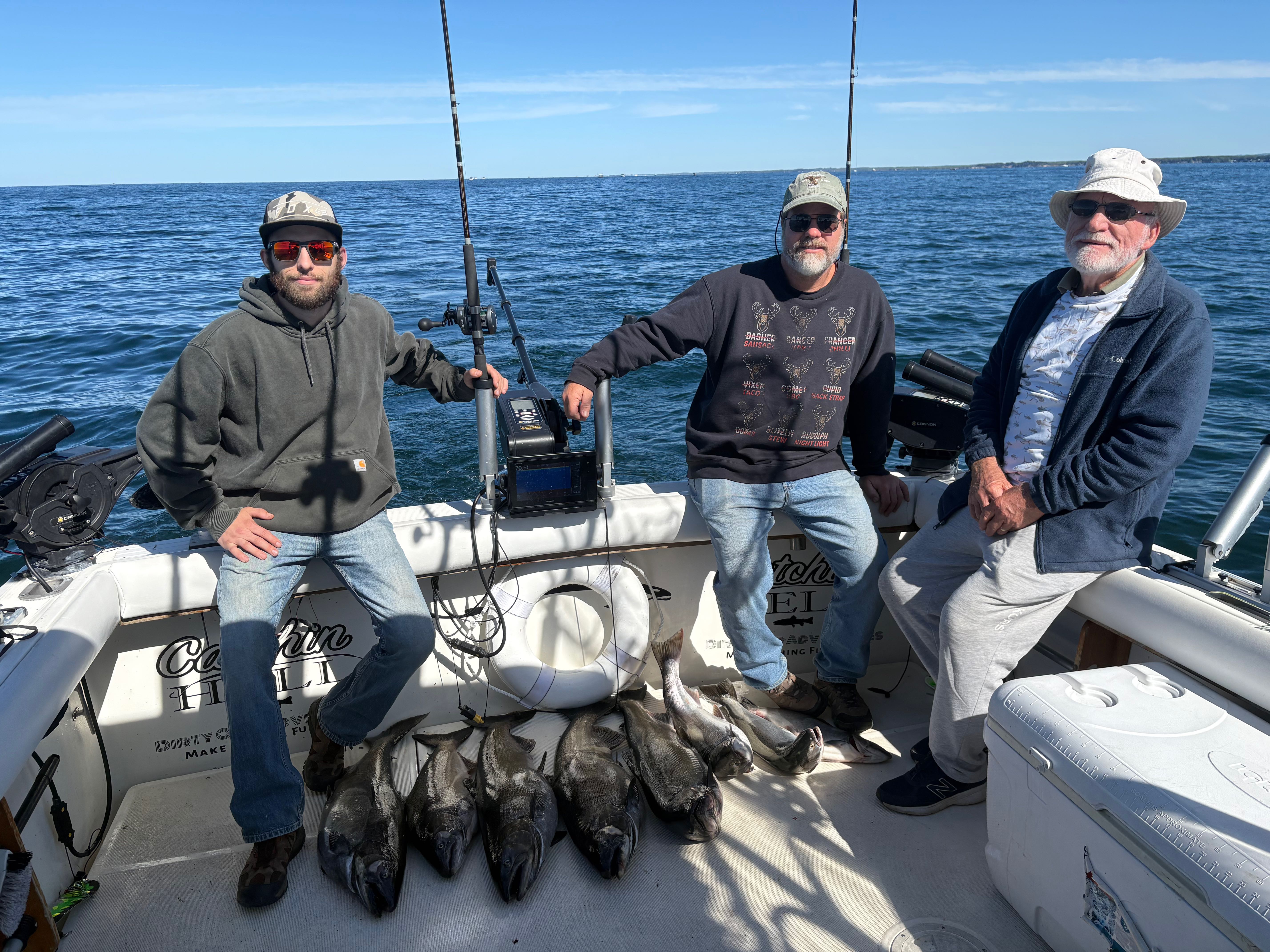 Successful fishing trip in Mexico NY showing caught Chinook salmon on boat deck
