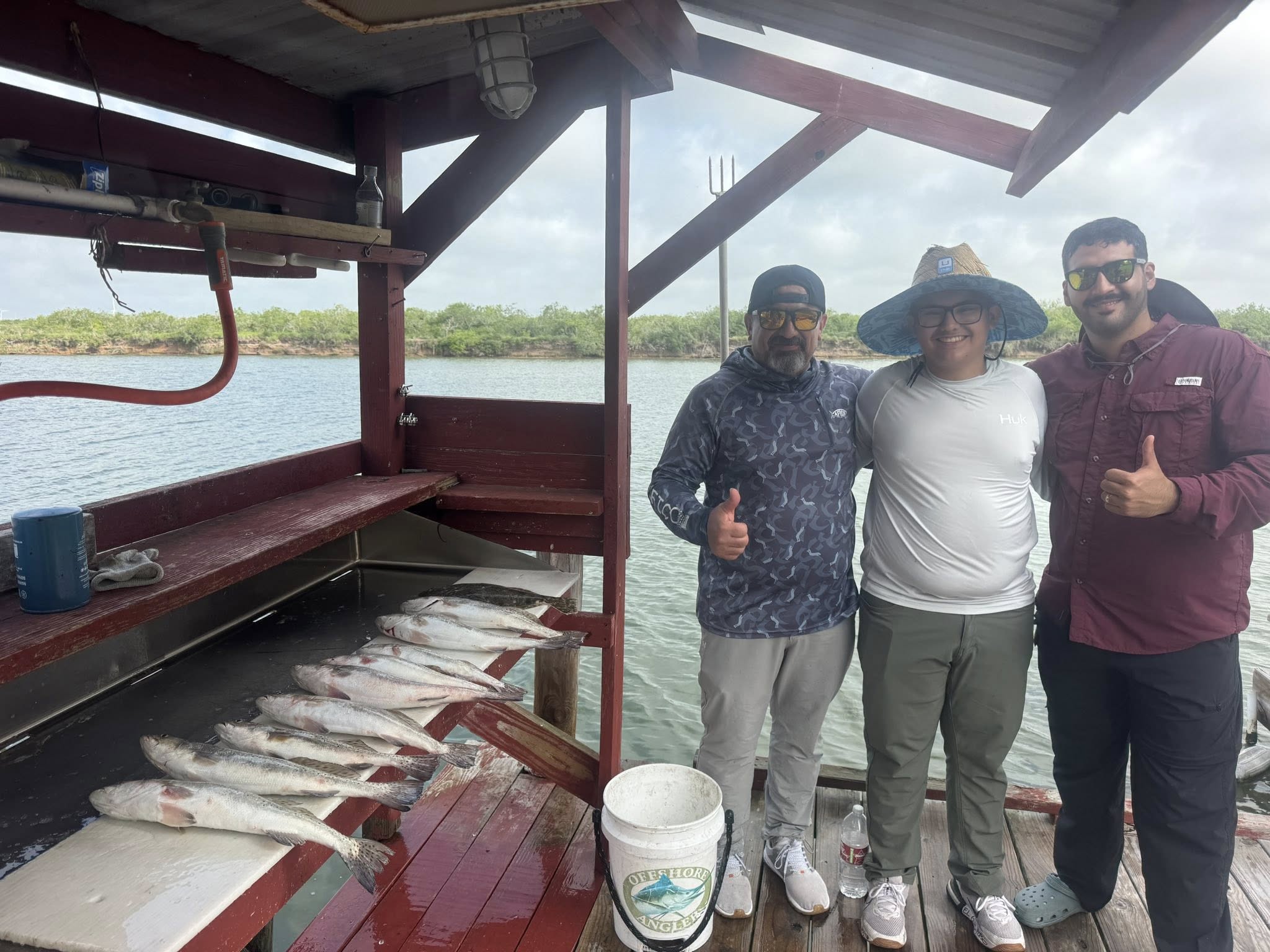 Successful fishing trip with fresh caught fish displayed on boat deck in Arroyo City TX