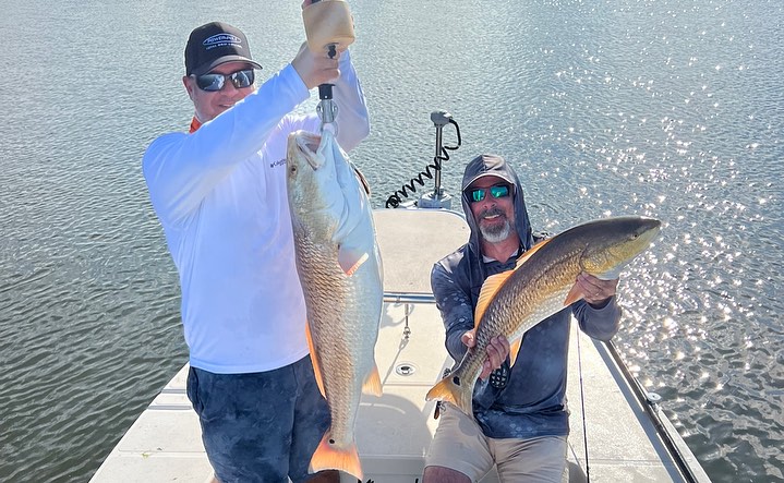 Two anglers fishing in Florida with big fish