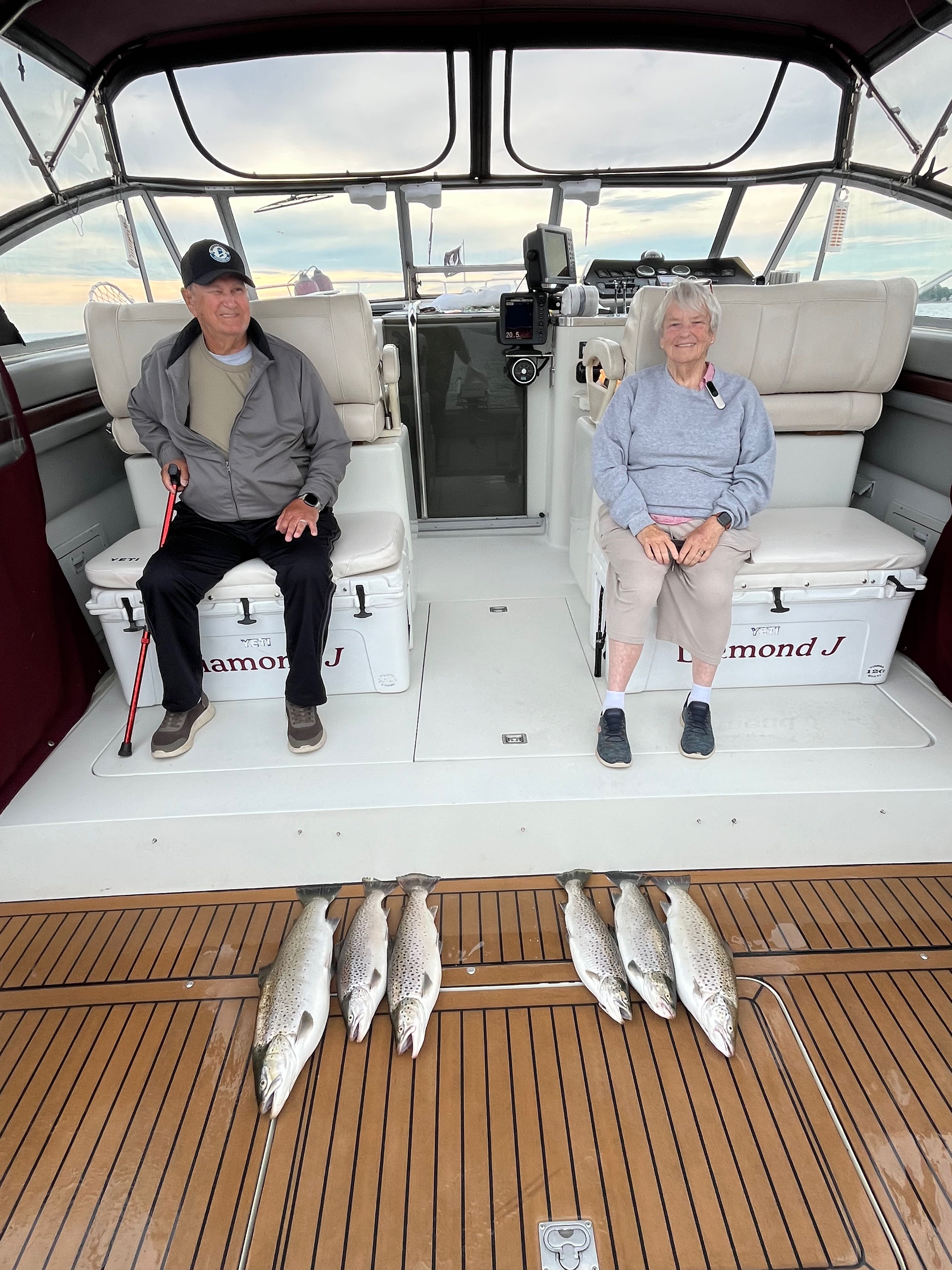 Fresh caught brown trout displayed on boat deck after successful fishing trip in Sodus Point NY