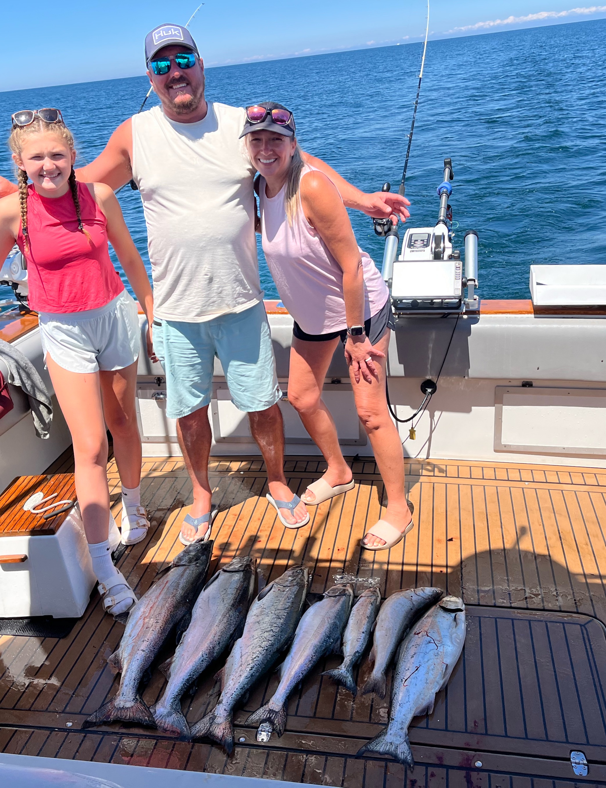 Successful fishing trip with multiple Chinook salmon caught on boat deck at Sodus Point NY