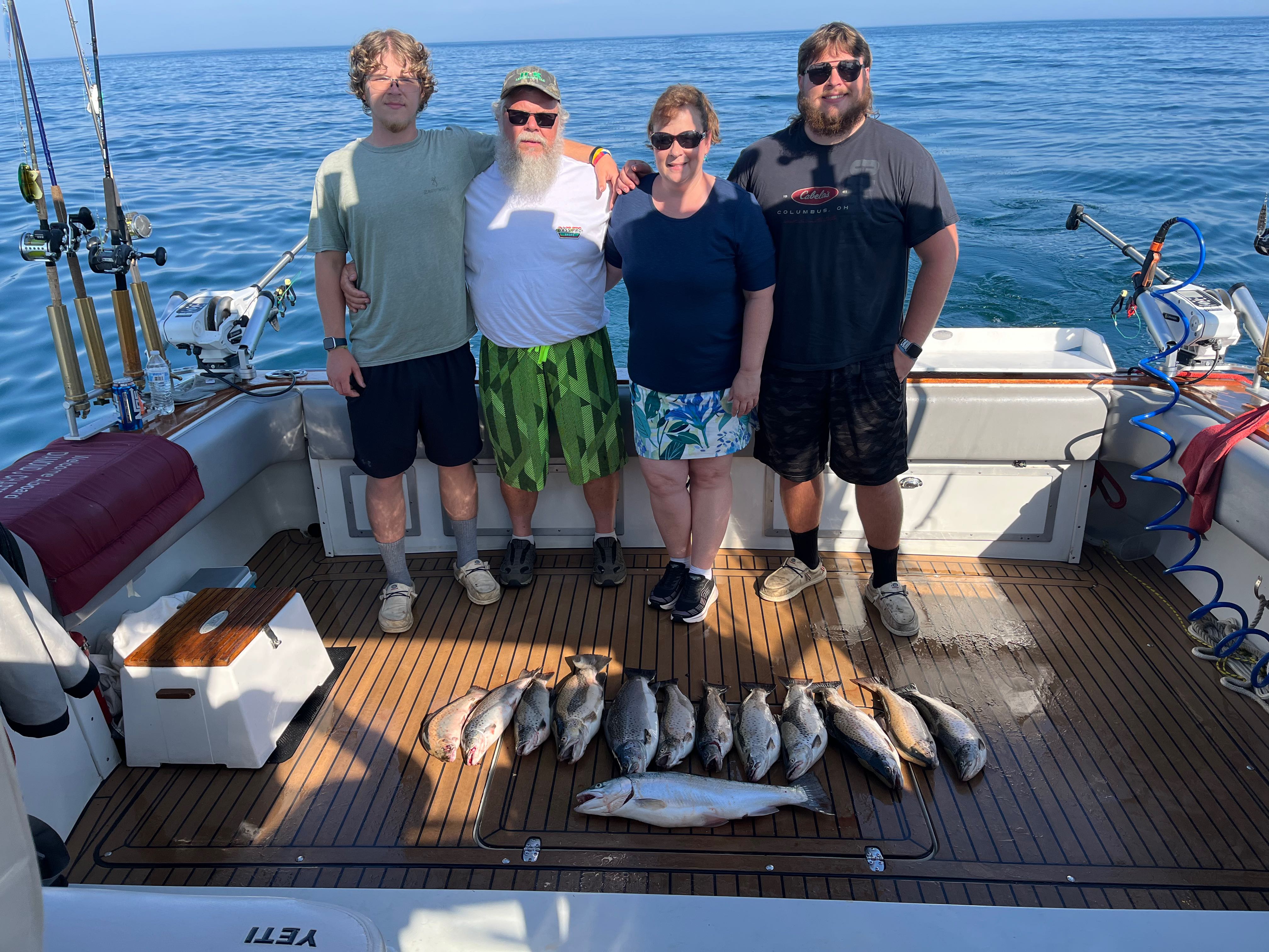 Fishing charter catch display on boat deck in Sodus Point NY with multiple fish species
