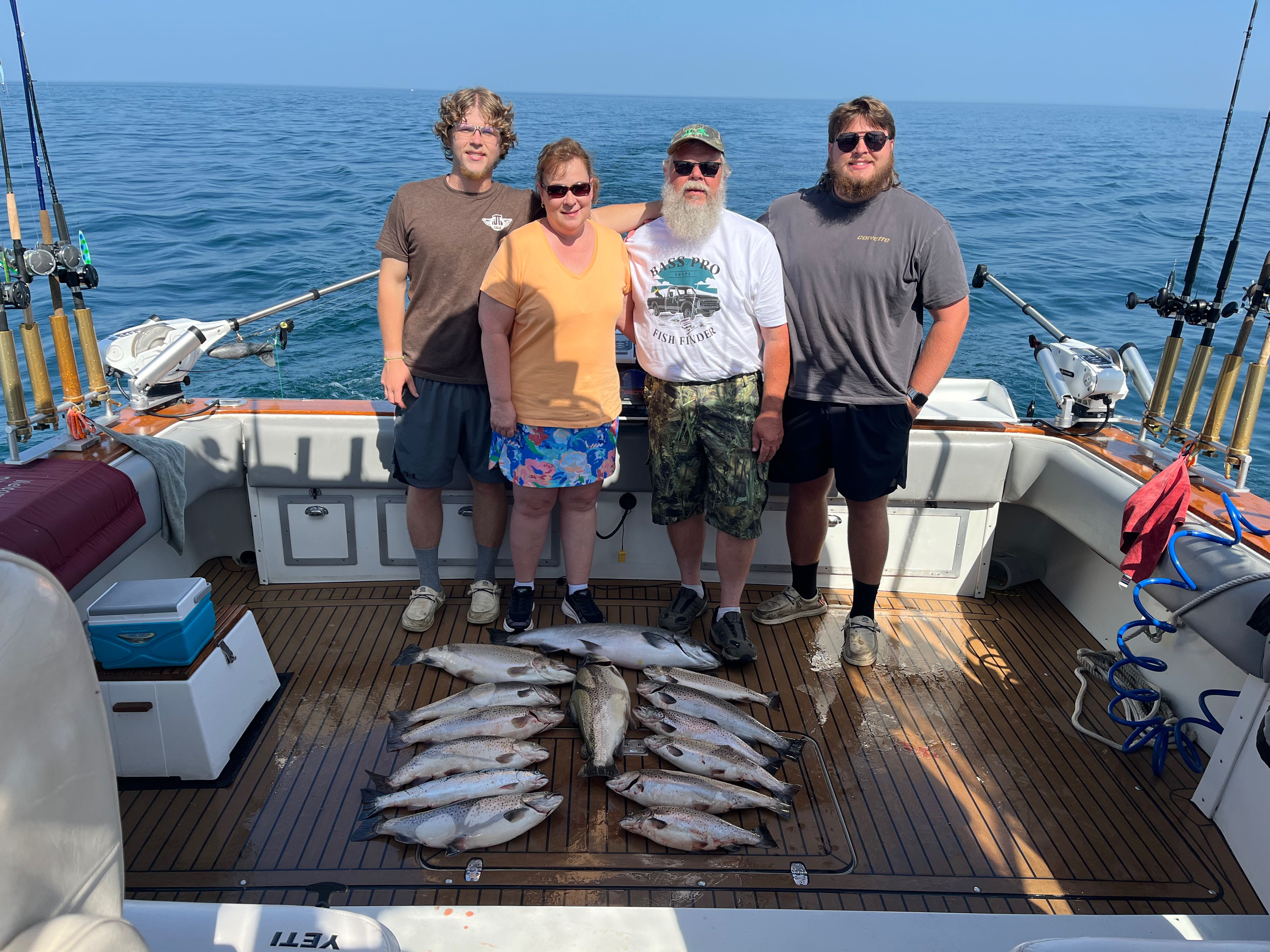 Successful fishing trip in Sodus Point NY with large catch of fish displayed on boat deck