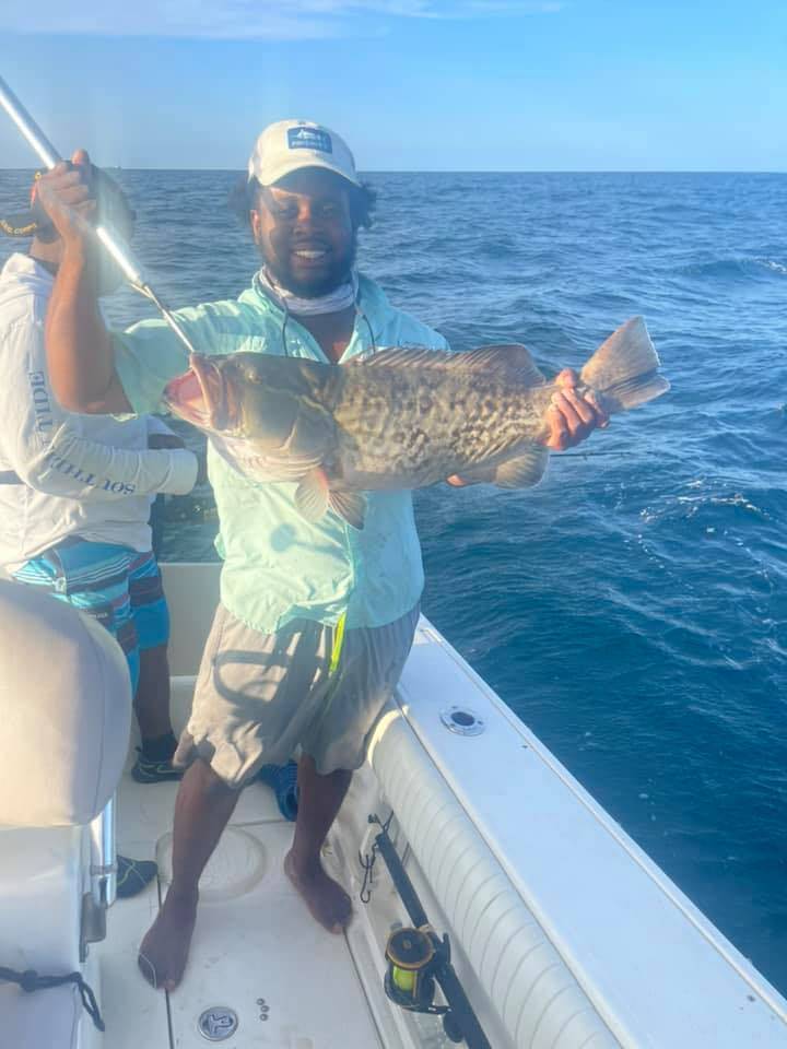 Angler proudly holding a 20-inch fish in SC