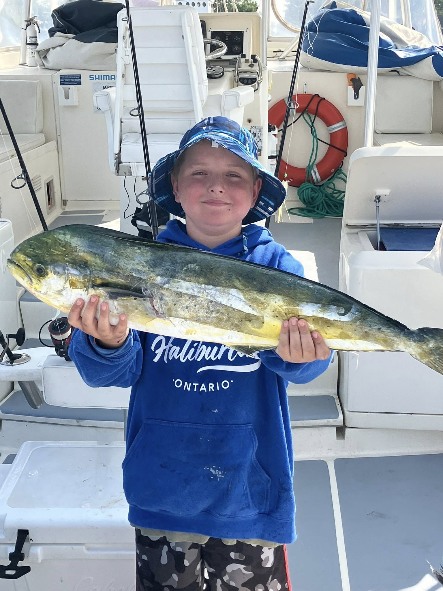 Fresh caught mahi mahi displayed on fishing boat deck in Lewes DE
