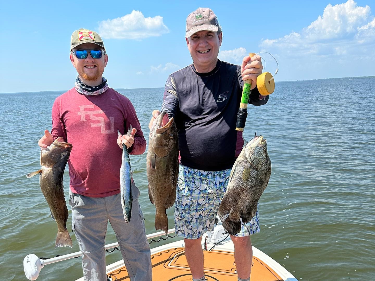Four Tripletail and Spotted Weakfish fish caught in Apalachicola