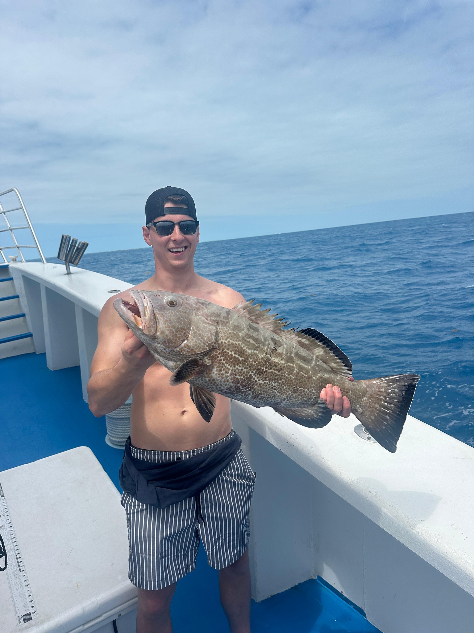 Photograph of a Black Grouper, a 27-inch fish caught while fishing on Stock Island.