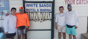 Three anglers fishing in Port Isabel