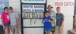 Group of 5 people fishing in Port Isabel