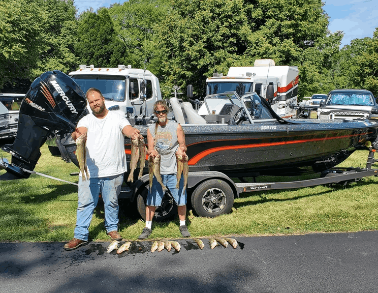 Two people fishing in MI