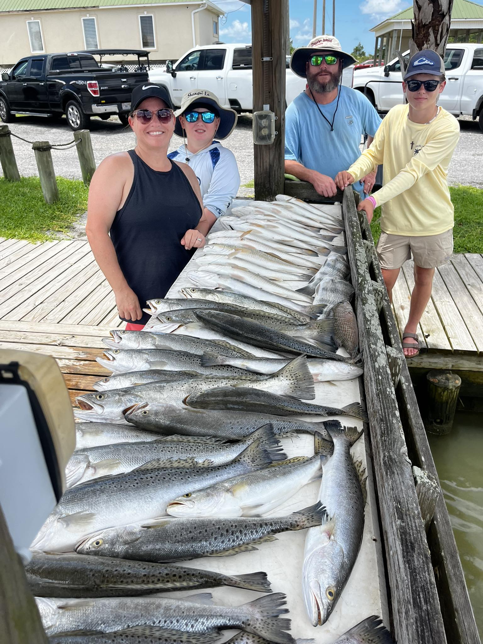 Large catch of speckled trout displayed on fishing dock at Dauphin Island AL