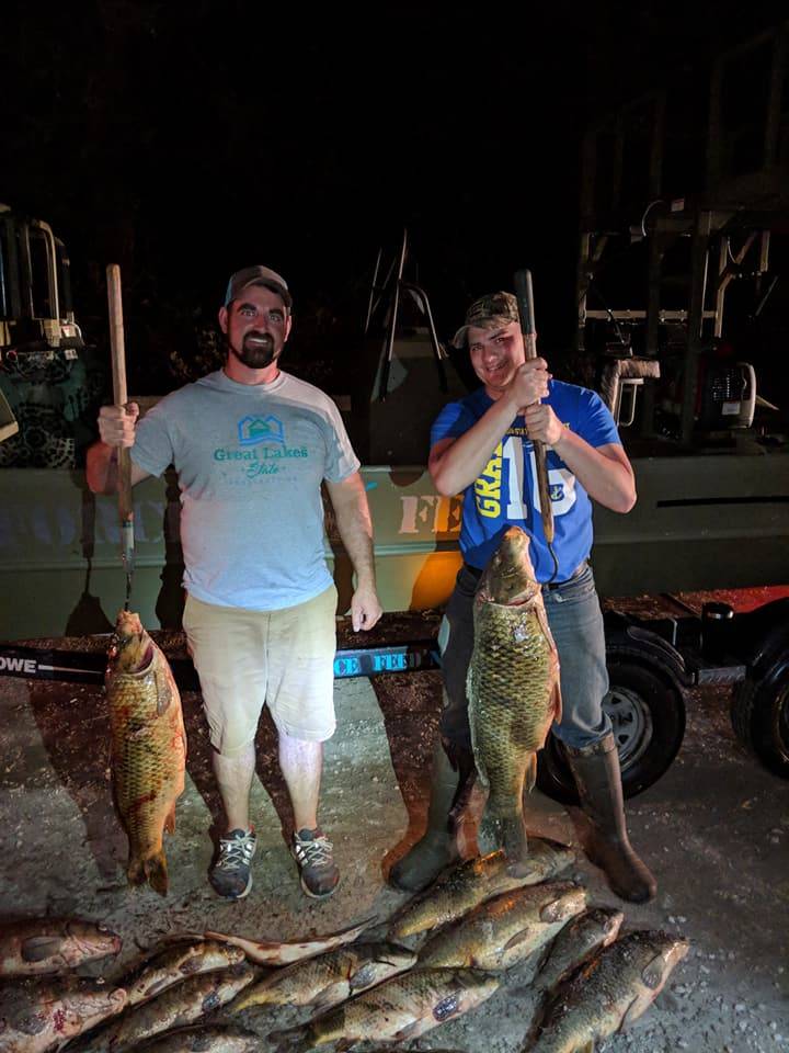 Two anglers enjoying a day of fishing at Saginaw Bay