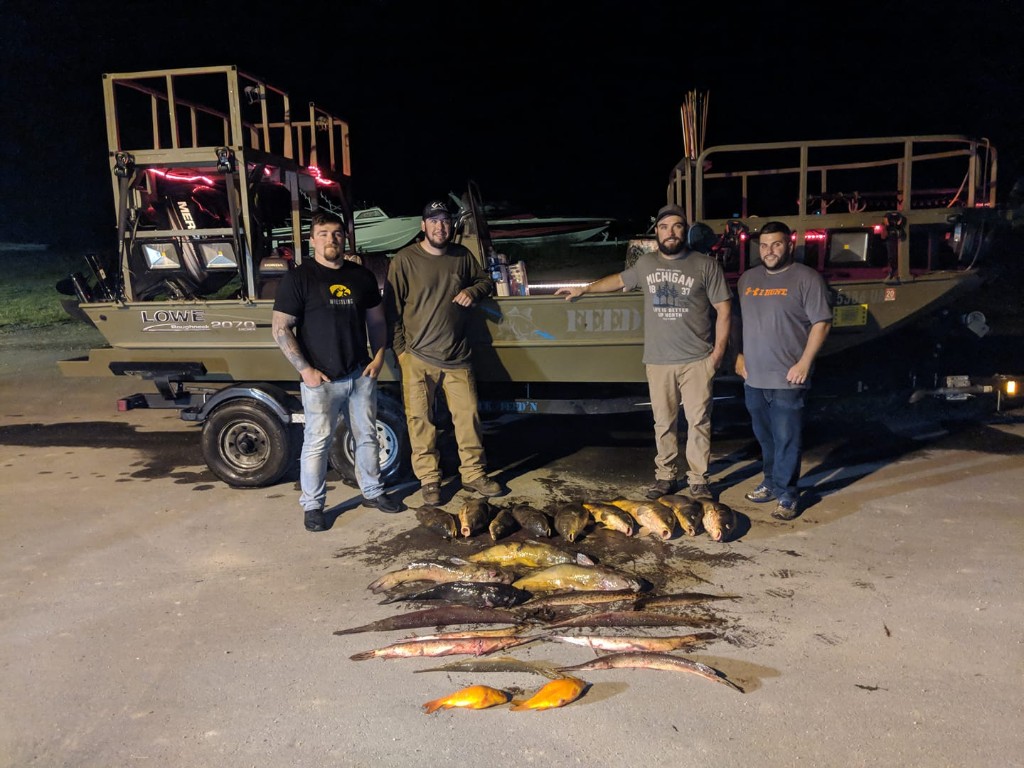 Group of four people enjoying outdoor activity by Saginaw Bay
