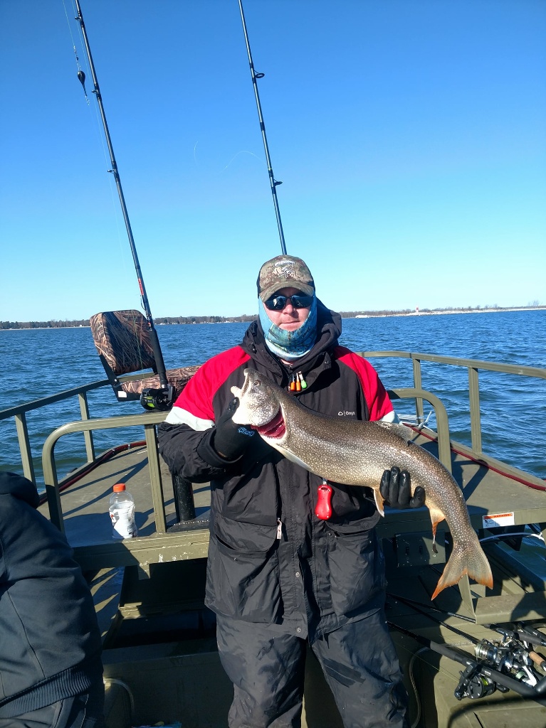 One angler holding a 22-inch fish in Saginaw Bay