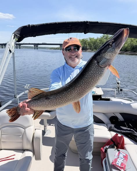 Northern pike fishing success on boat in Stillwater MN waters