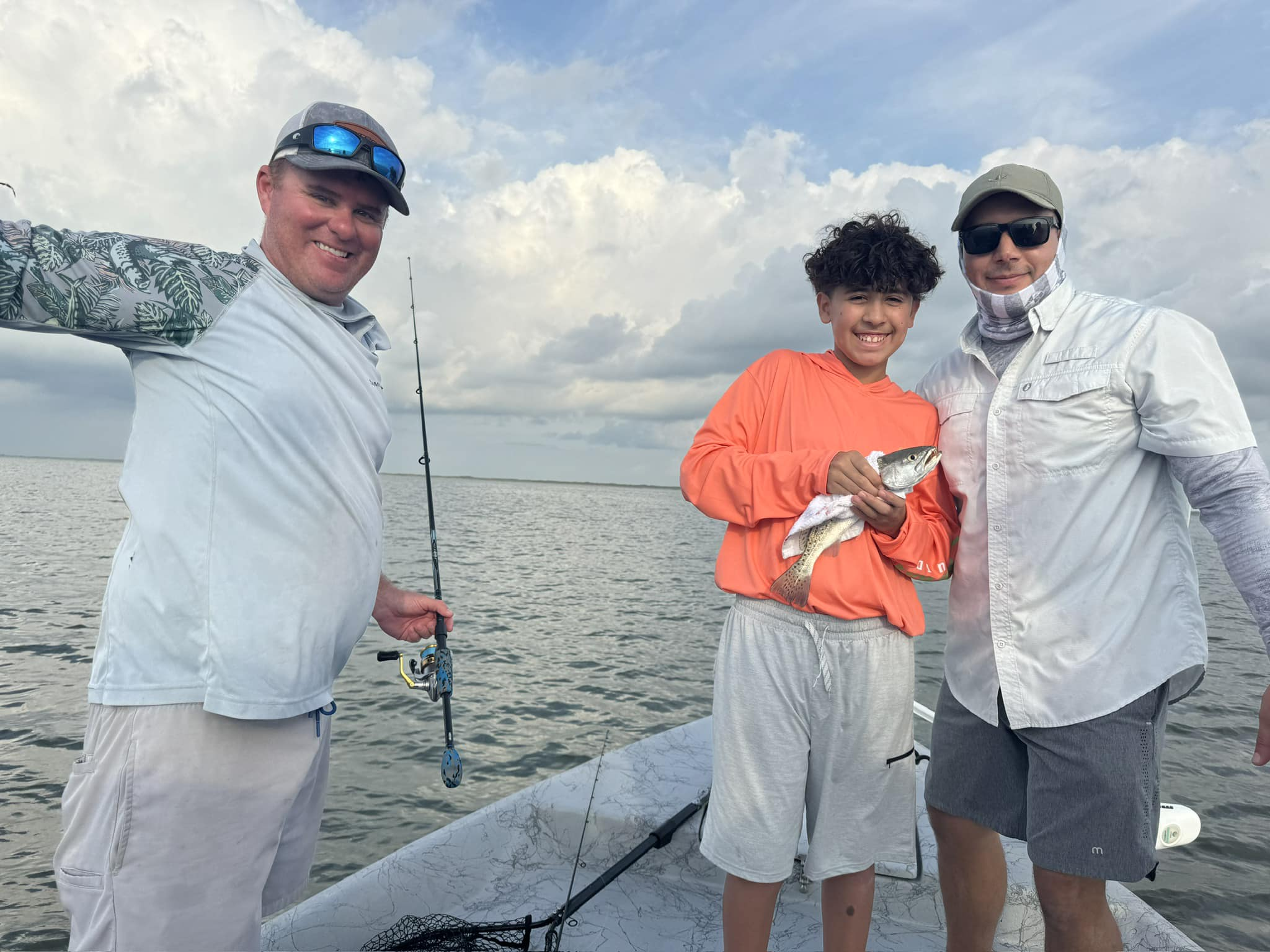 Three people fishing in TX