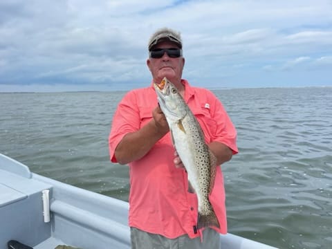 A lone angler fishes in the waters of Nags Head