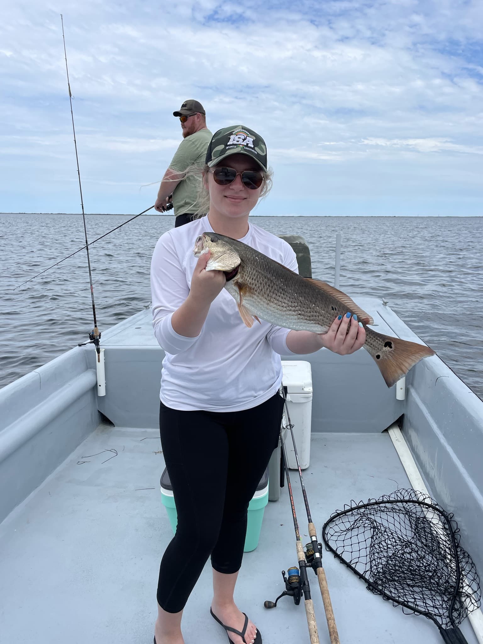 A picture of two people fishing at Nags Head