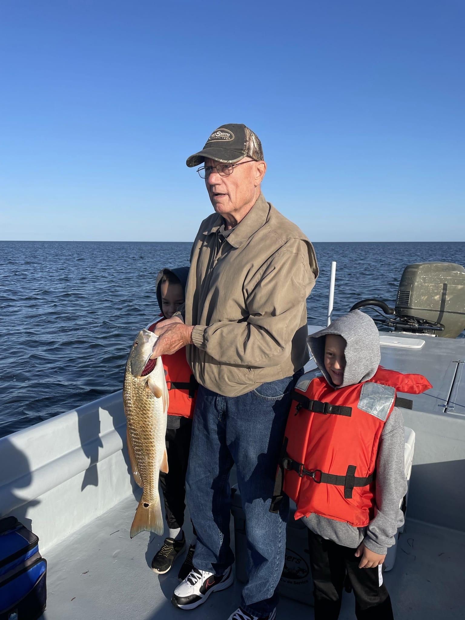 Redfish caught by three people in Nags Head, North Carolina