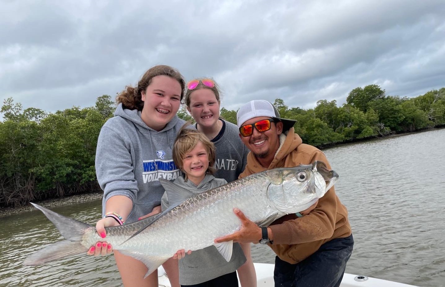 A tarpon, a big 36-inch saltwater fish, caught while fishing in FL