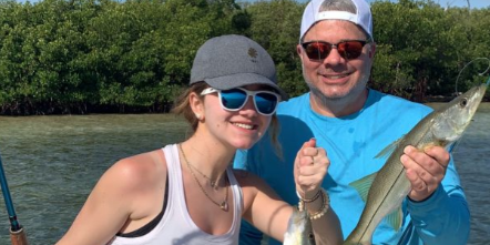 A couple enjoying a fishing tour in Fort Myers