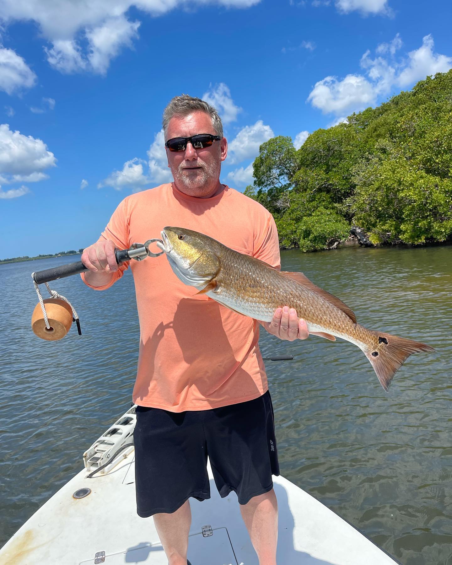 Angler with a large redfish catch in Florida
