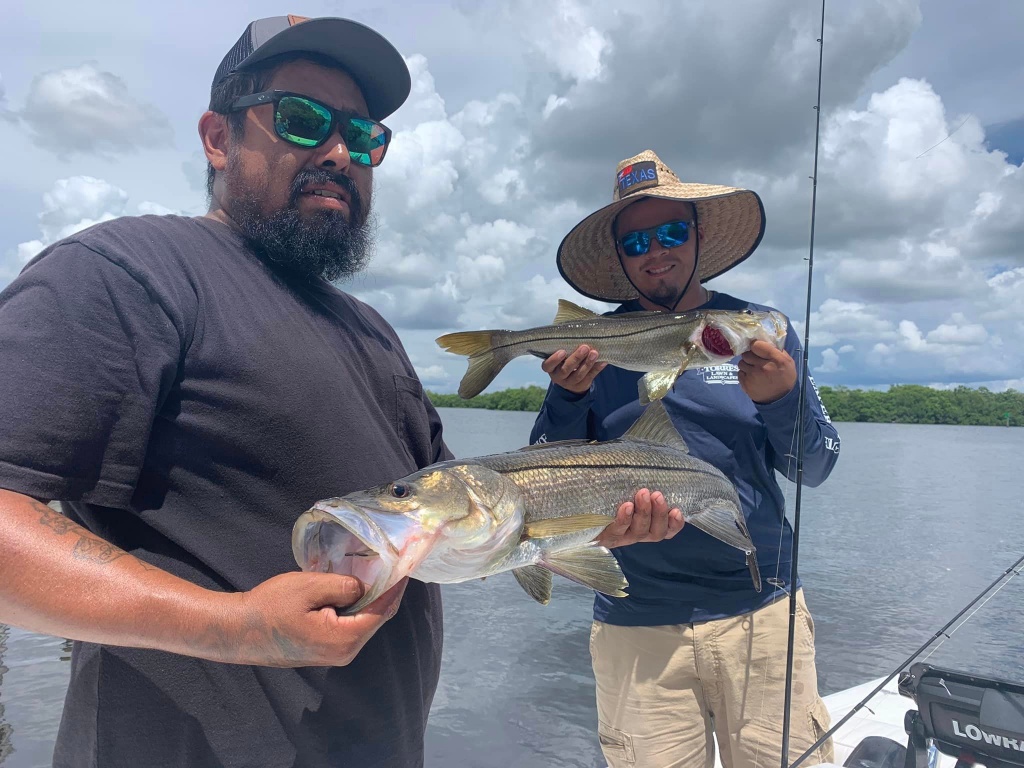 Two anglers with a catch of 14-inch fish in Florida