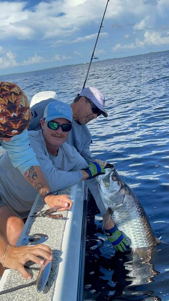 Two people holding fishing rods in Port Charlotte