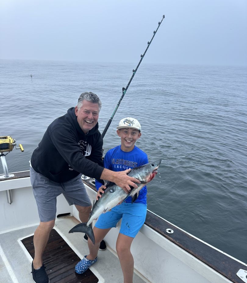 Successful fishing trip in Gloucester MA with freshly caught fish on boat deck