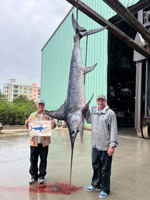 Large swordfish hanging at dock in West Palm Beach FL fishing marina