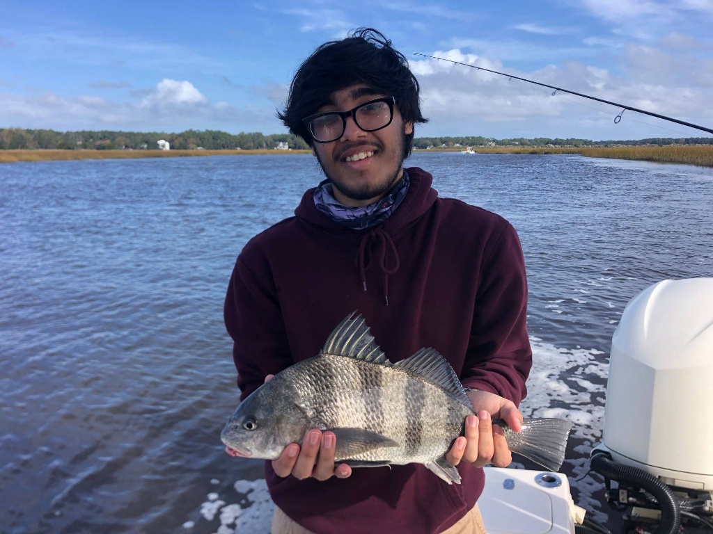 Angler with 12-inch black drum fish at North Myrtle Beach