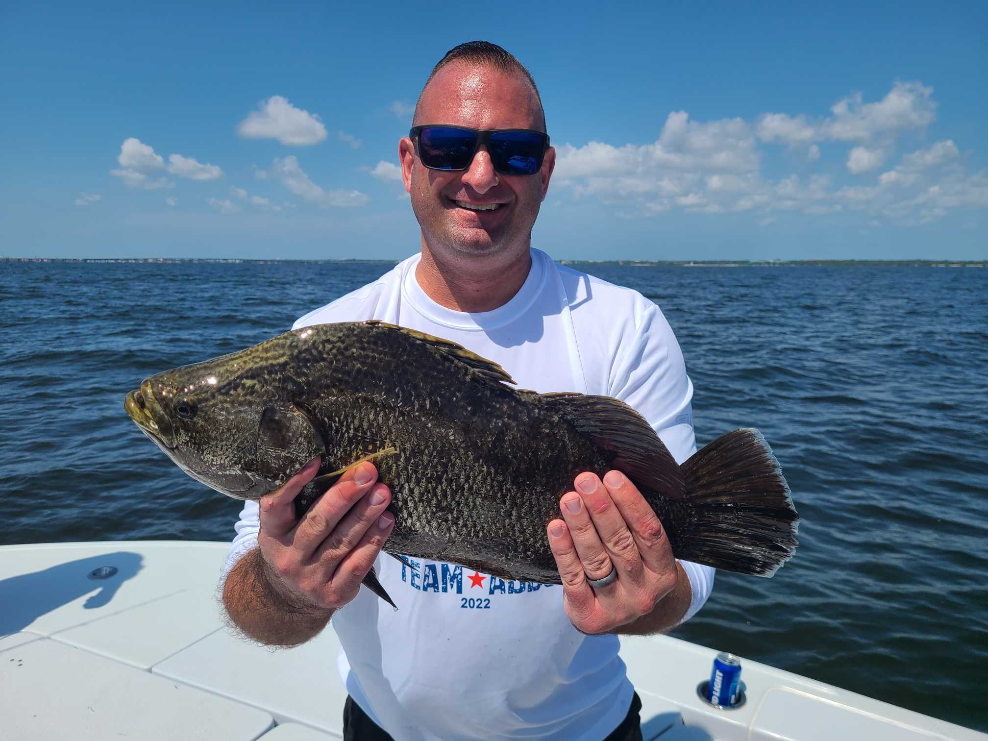 Angler with a fishing rod enjoying the sunny day in Tampa