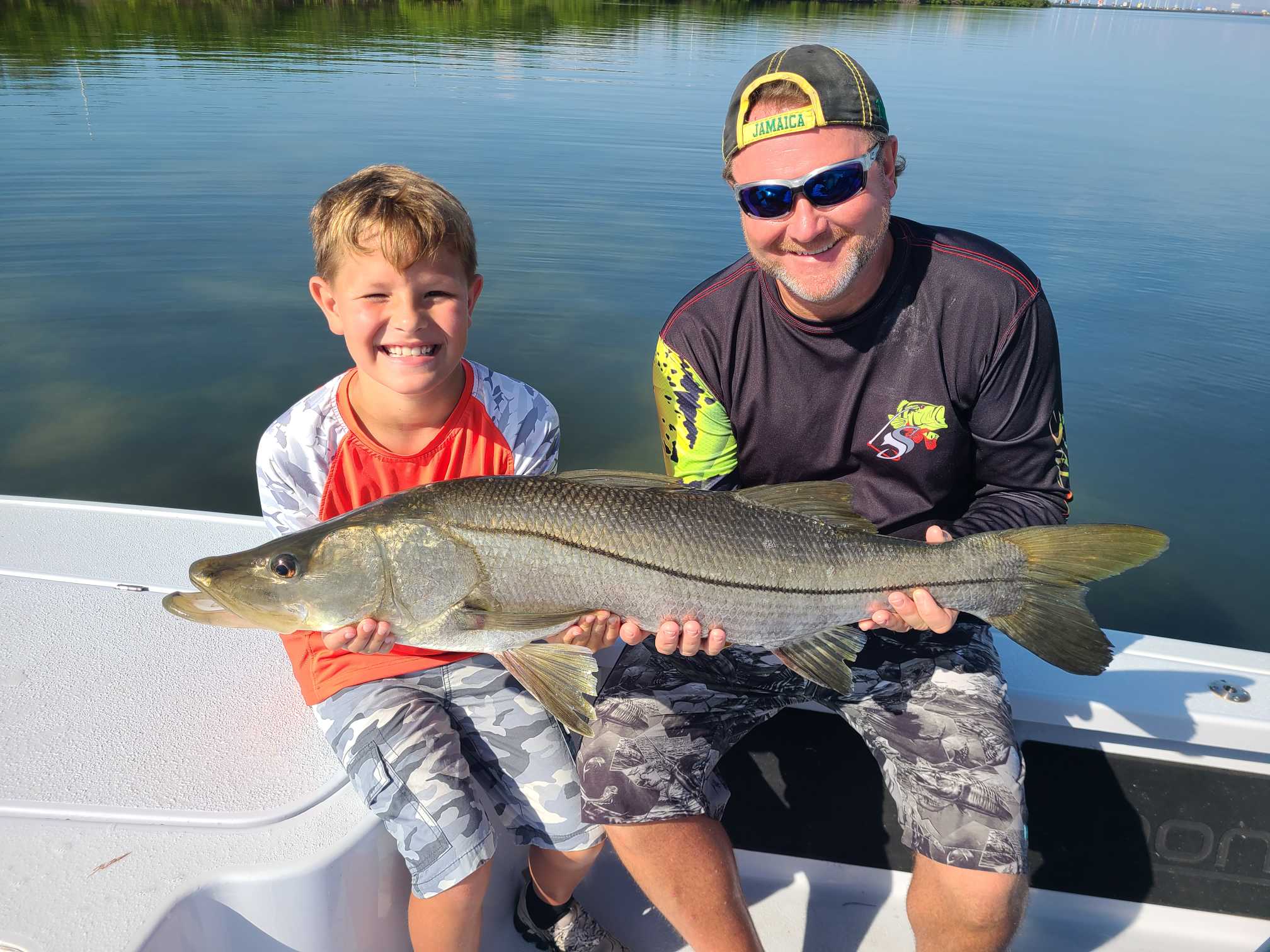 Angler catches a large Snook fish in FL