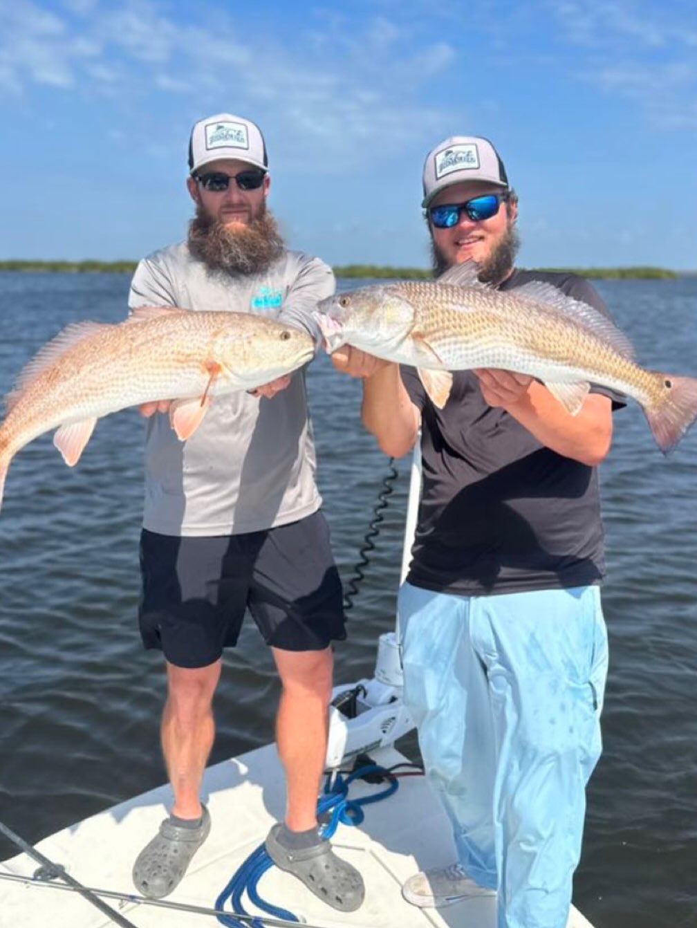 Two anglers fishing for redfish in Florida
