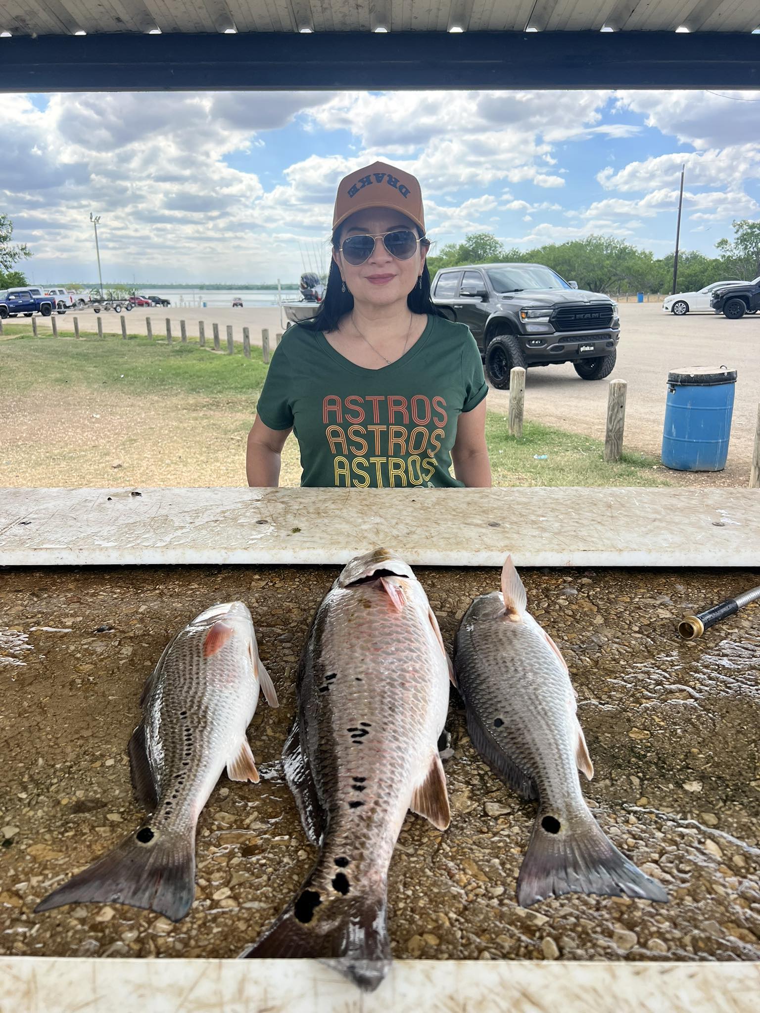 Three redfish caught fishing in Elmendorf TX displayed on cleaning table