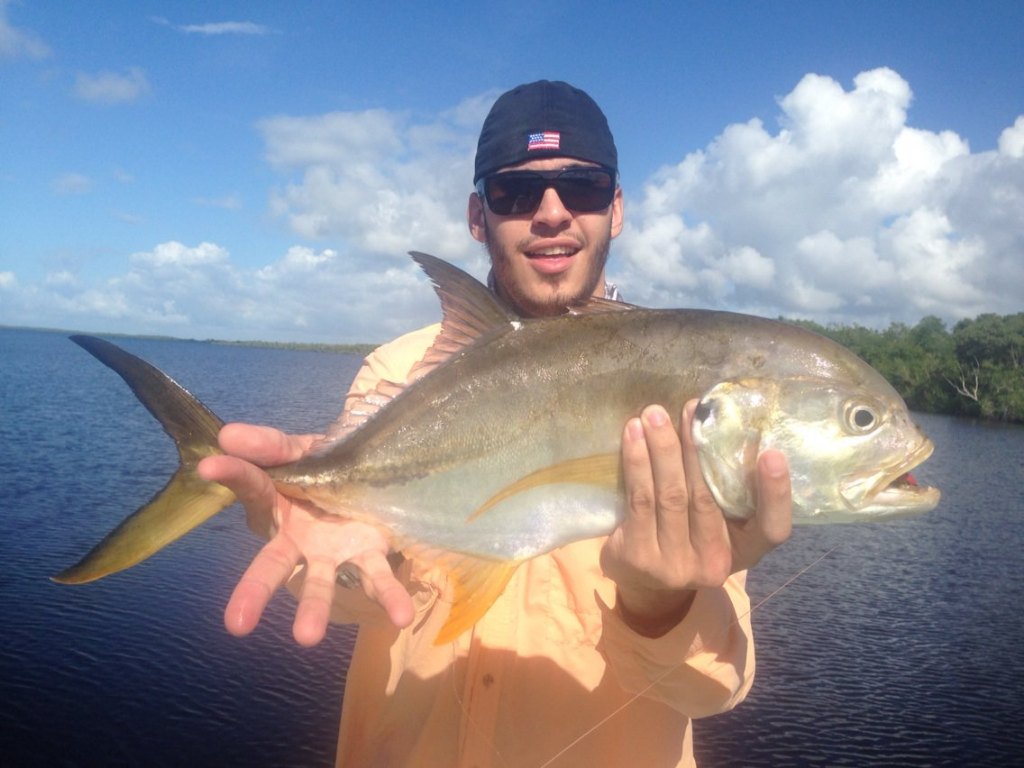 One person catching a big 23-inch fish in FL